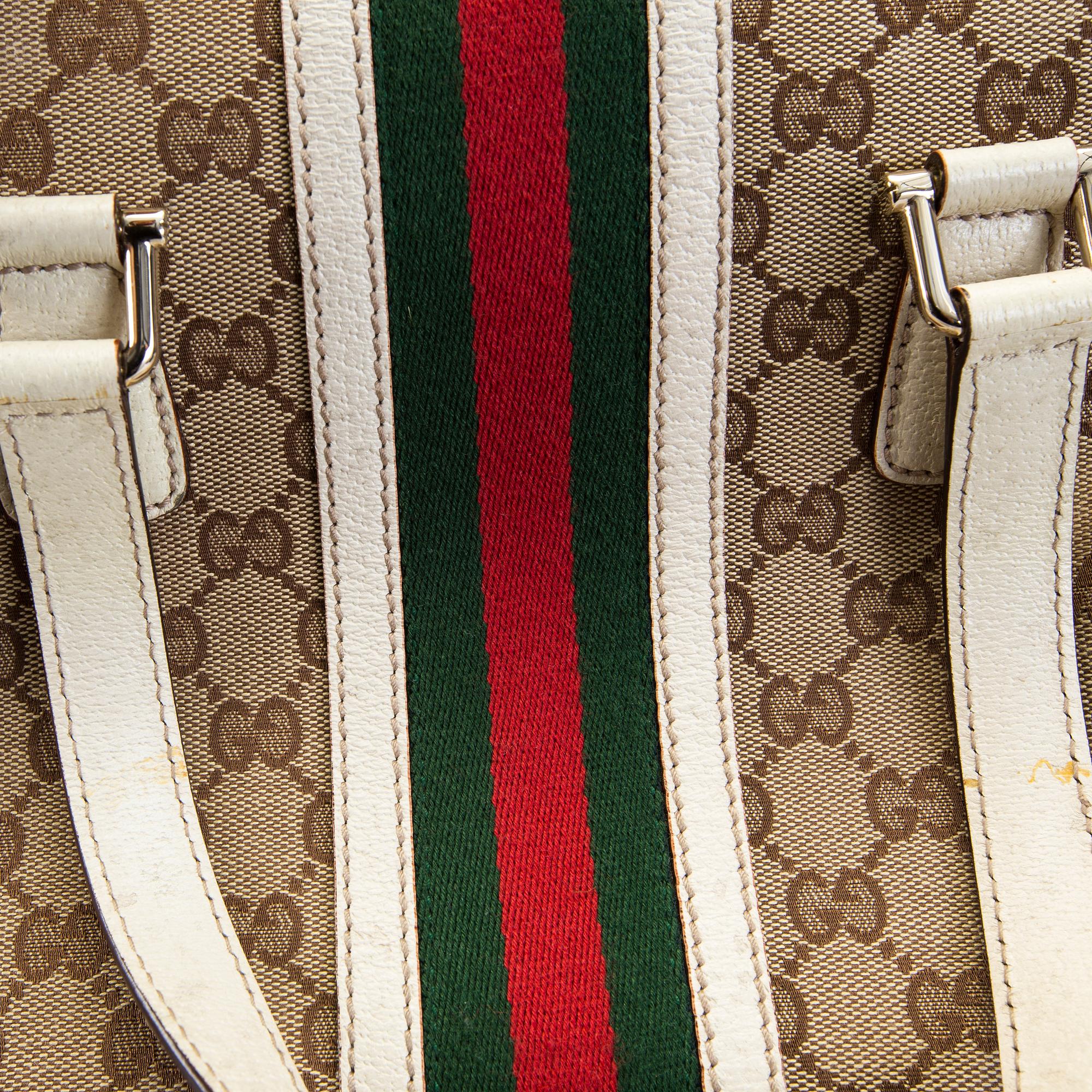 A Gucci canvas and leather hand bag.