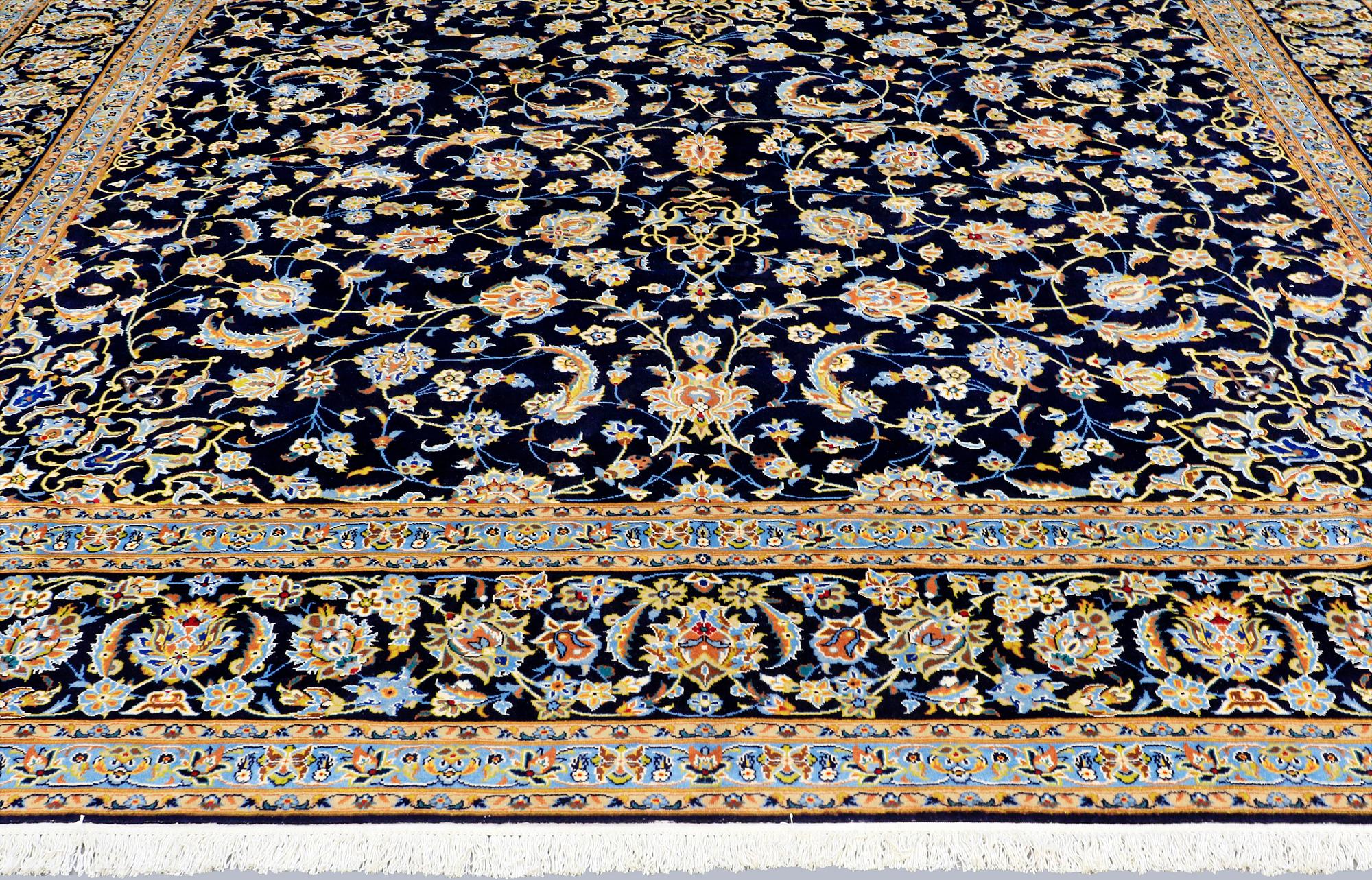 A Keshan carpet, signed, approx. 600 x 400 cm.