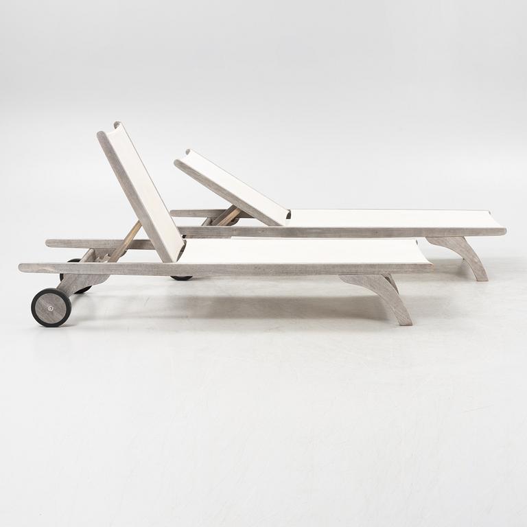 A pair of 'Columbus Sunbed' teak deck chairs, Skagerak, Denmark.