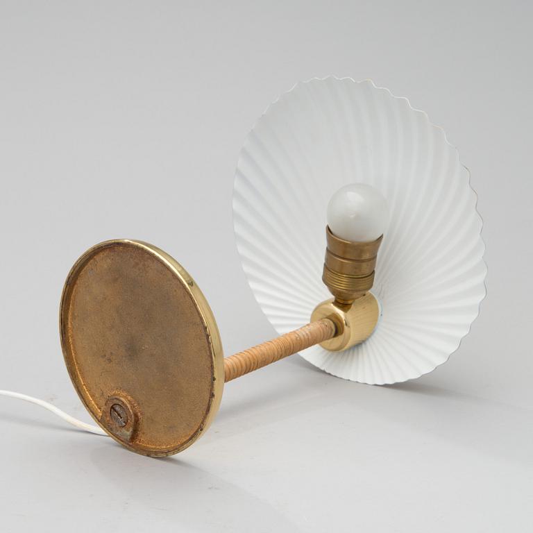 PAAVO TYNELL, A DESK LAMP. A shell.  Manufactured by Taito Oy. Designed in 1938/39.