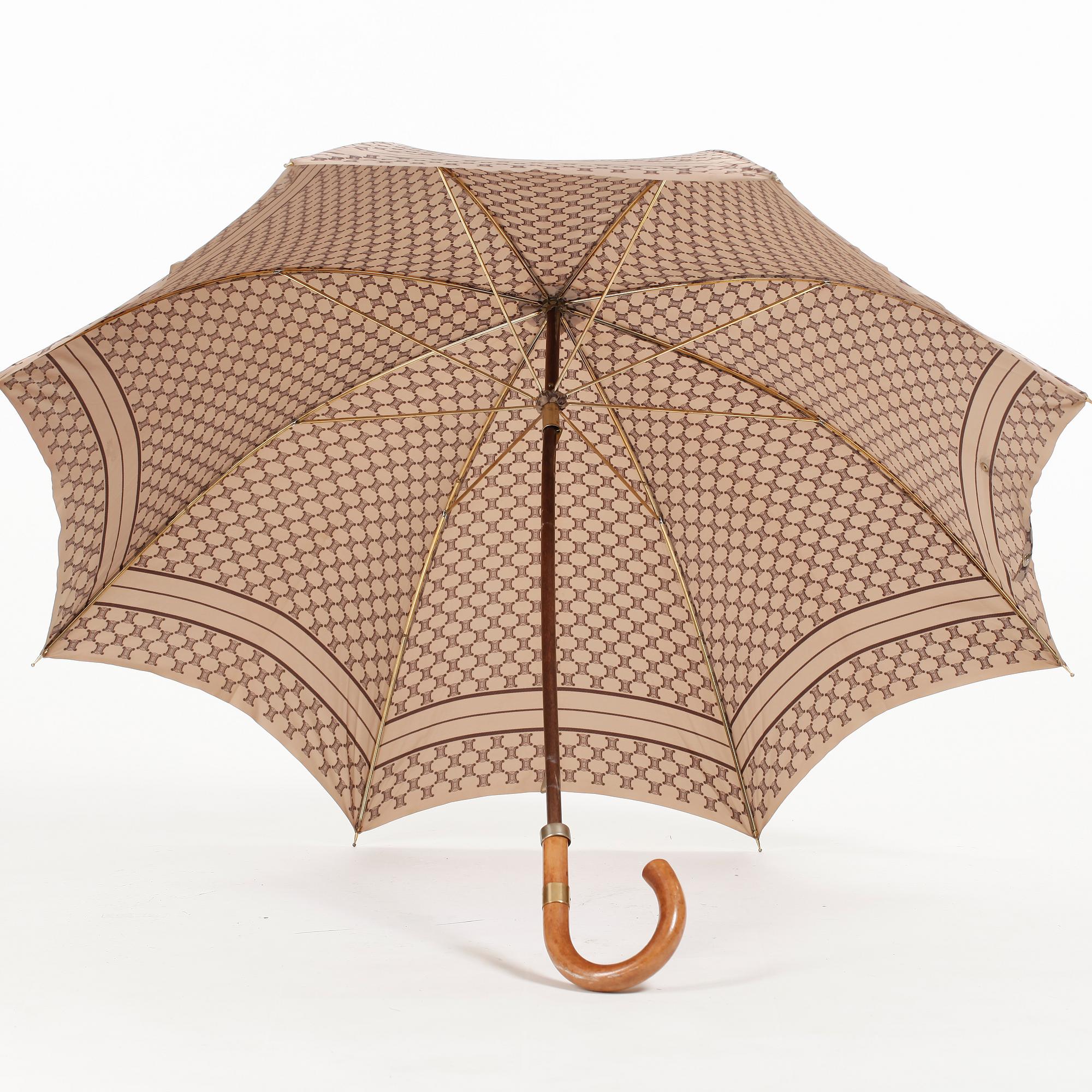 CÉLINE, a beige monogram umbrella.