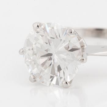 A SOLITAIRE RING set with a round brilliant-cut diamond.