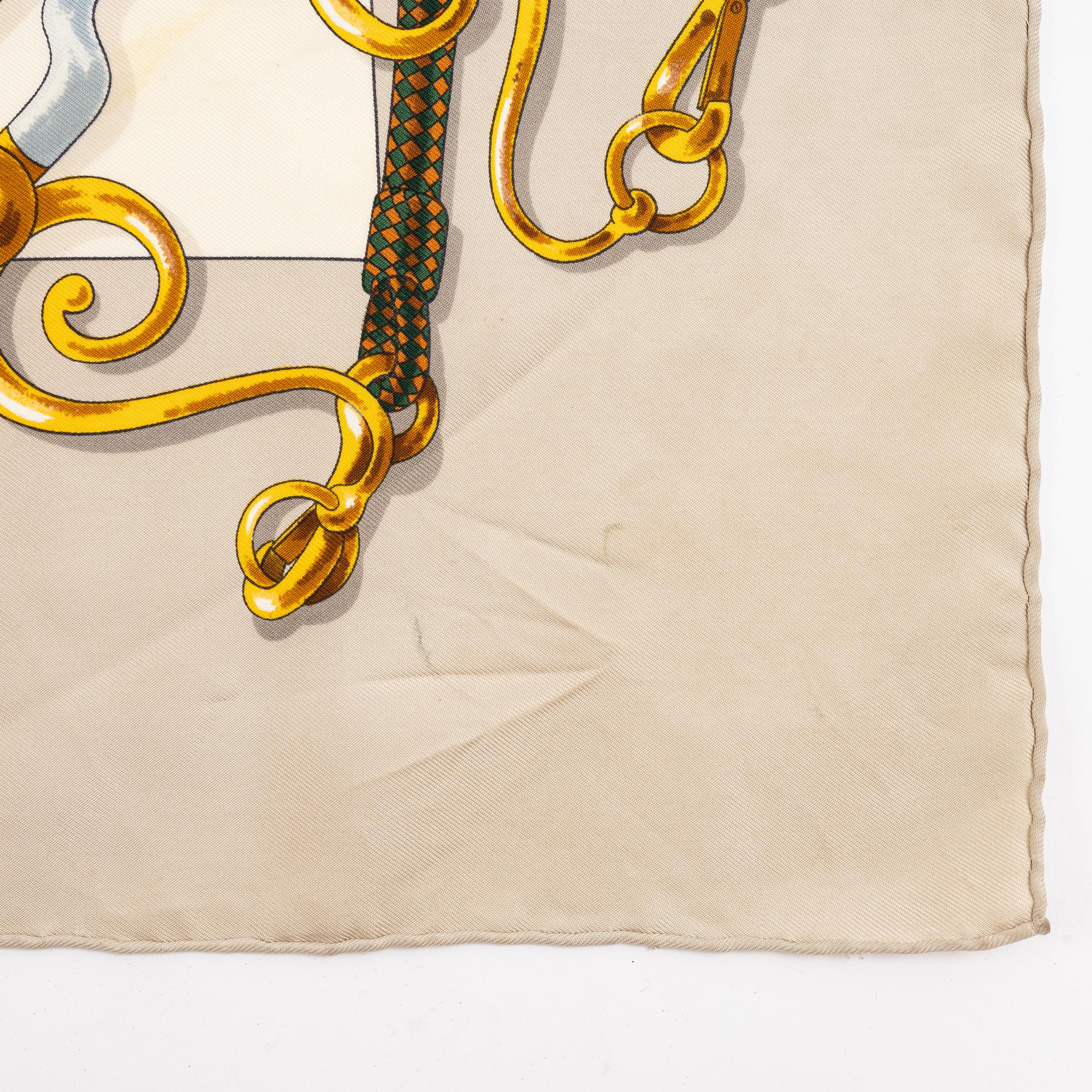 Hermès, a 'Festival' silk scarf.