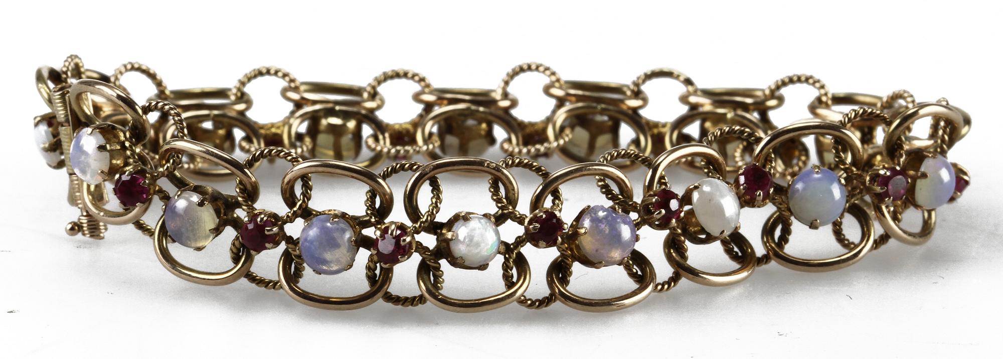 ARMLÄNK, 14 K guld, rubiner samt stenar.