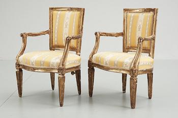 39. Two 18th century armchairs, probably Italian .