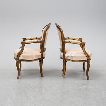 A pair of Louis XV-style arm chairs, 20th century.