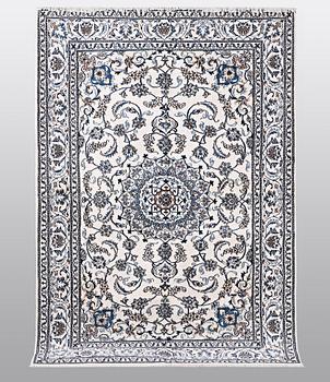 A carpet, Nain, 285 x 196 cm.