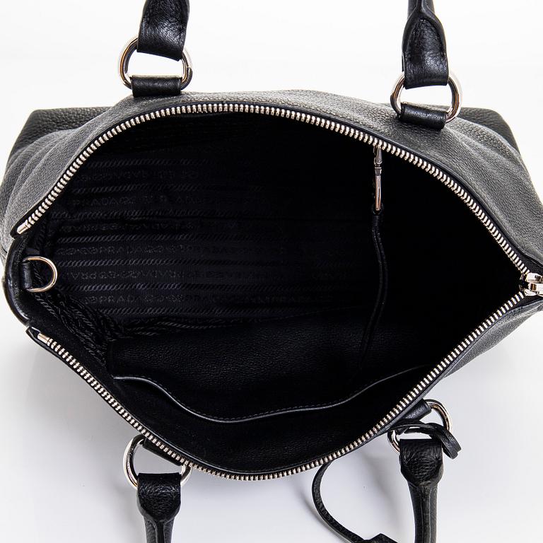 Prada, a leather bag.