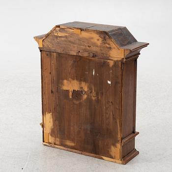A wall cabinet, 18th century.
