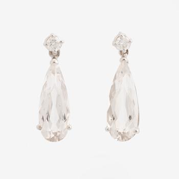 White topaz and brilliant cut diamond earrings.