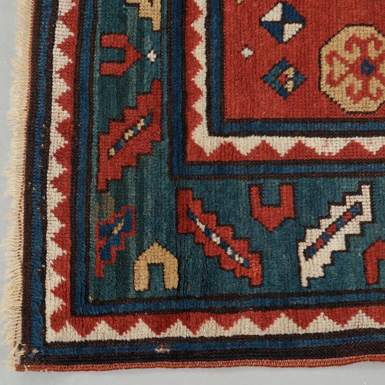 A RUG, an antique Karachop Kazak, ca 213 x 166 cm.