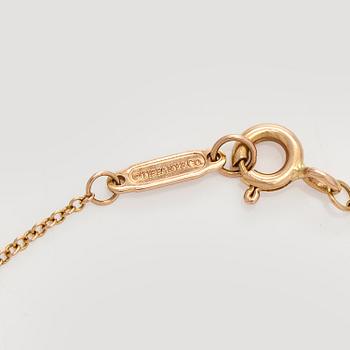 Tiffany & Co, an 18K gold 'Infinity Endless' bracelet.