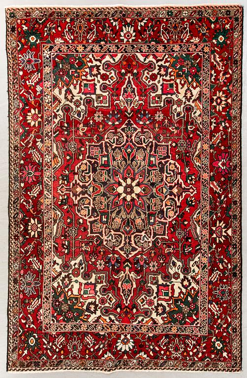 An old bachtiari carpet ca 310x210 cm.