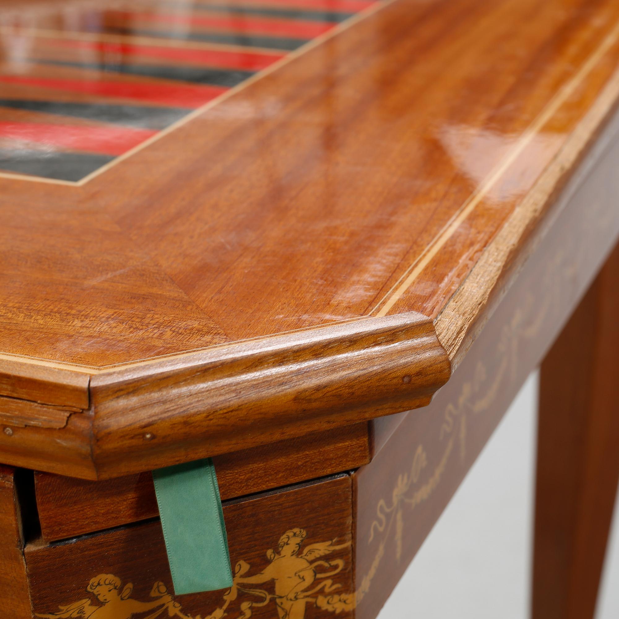 A gaming table and two chairs from Italy, 1950s.