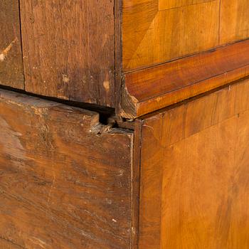A Swedish walnut-veneered rococo cabinet in the manner of C. Linning, latter half of the 18th Century.
