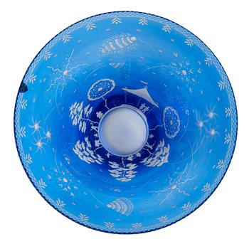 Edward Hald, an engraved blue glass "Fyrverkeriskålen" glass bowl, Orrefors 1957, engraved by Karl Rössler.