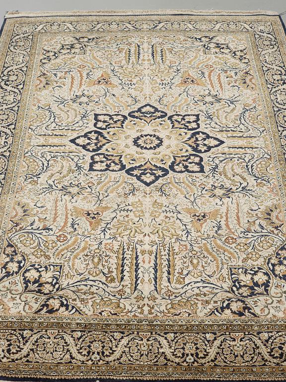 A silk Qum carpet, around  219 x 137 cm.