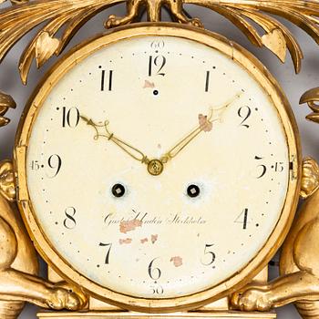 A Swedish Empire wall clock by G Undén (Stockholm 1800-1829).