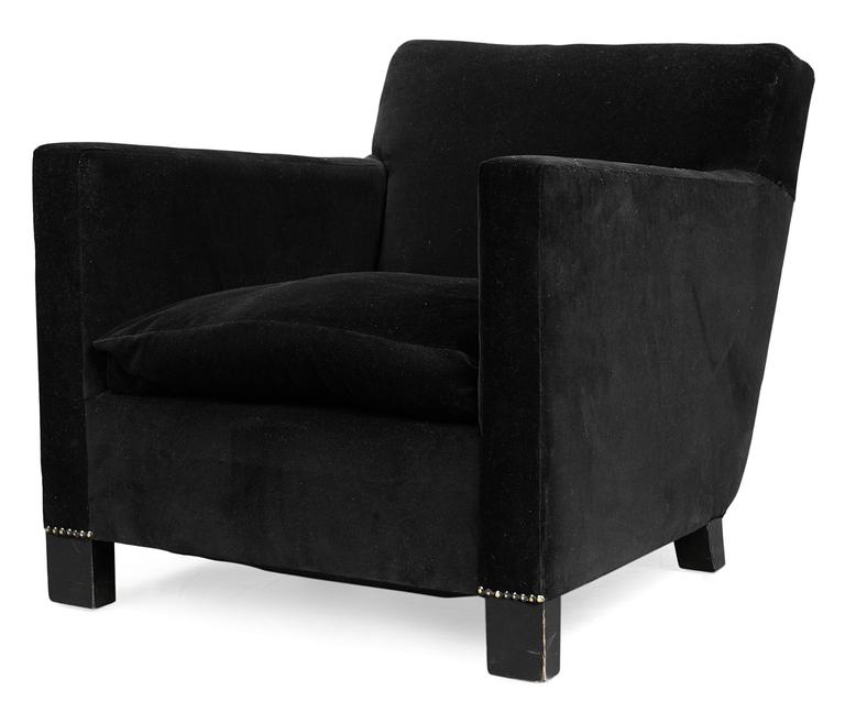 An Uno Åhrén black velvet and black stained birch sofa, by Firma Svenskt Tenn circa 1930.