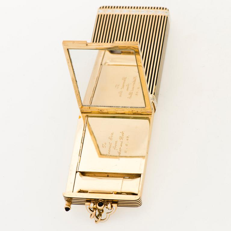 A Cartier Art Deco Vanity Case/Minaudière in 18K gold, black enamel and onyx.