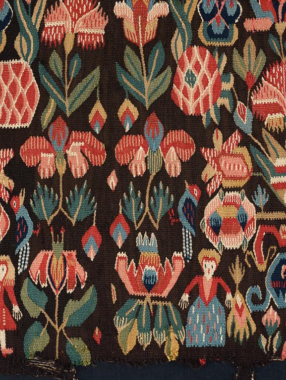 A CARRIAGE CUSHION FRAGMENT, tapestry weave, "Urnor och par", ca 51-53,5 x 92-97 cm, Scania (Sweden).