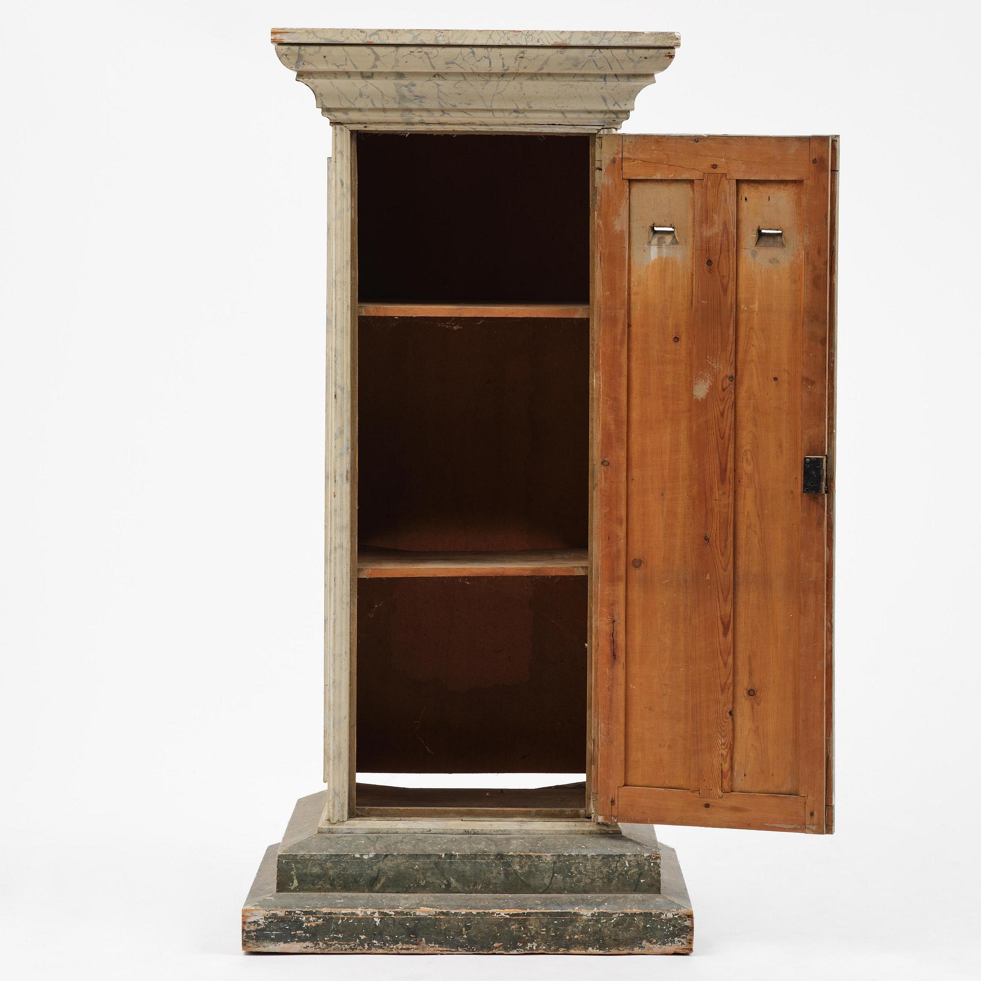 A Swedish column-shaped cabinet 19 th century.