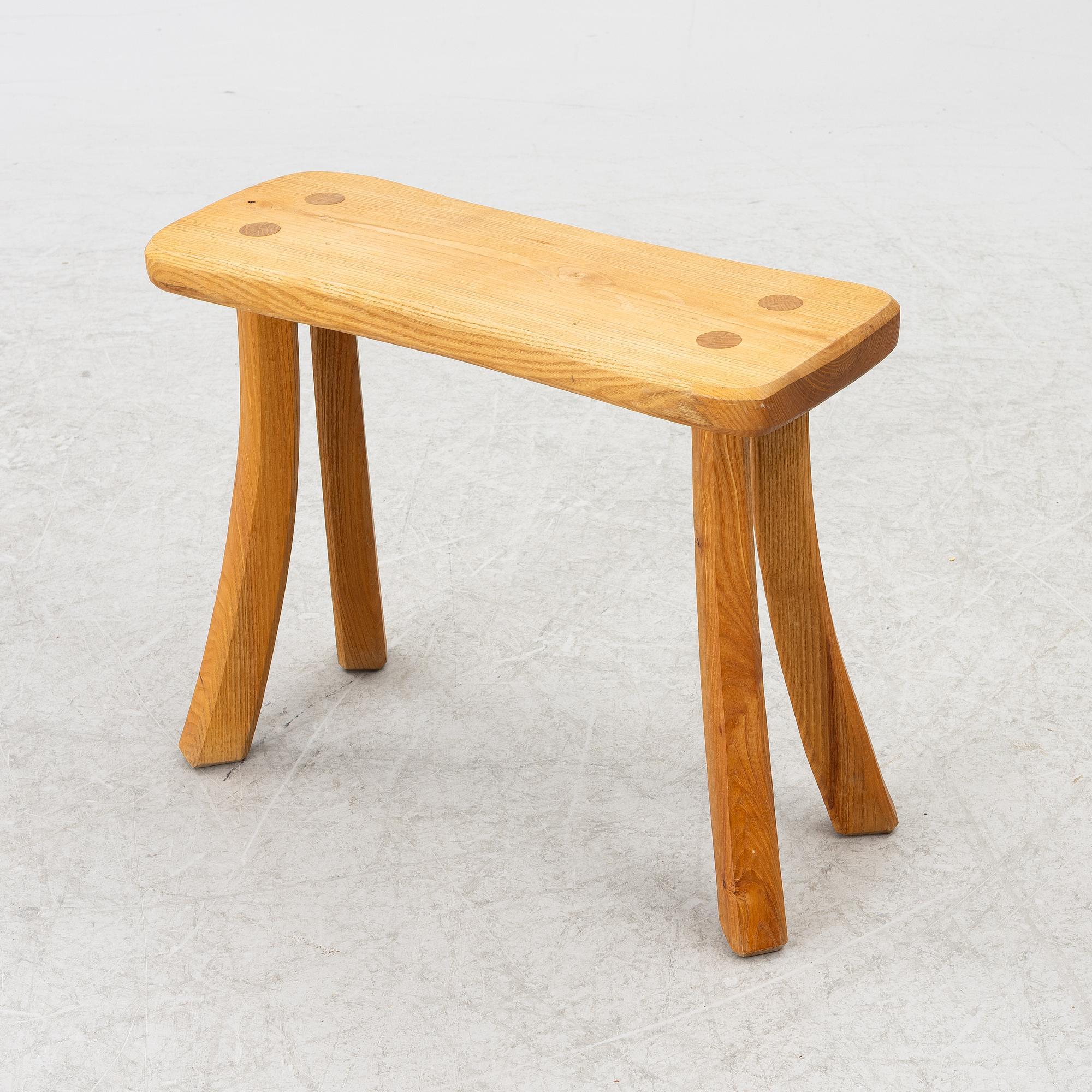 A solid pine stool, signed RO -99, Sweden.