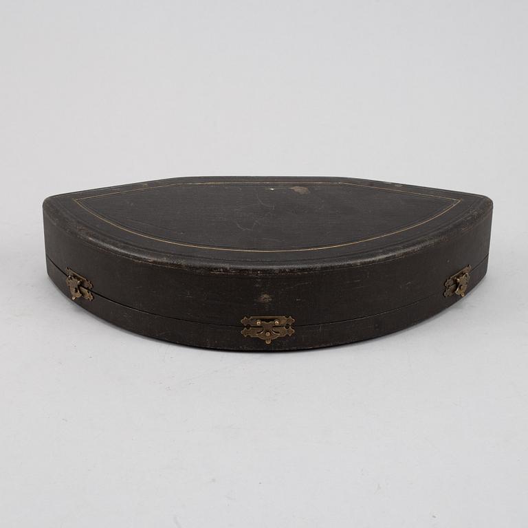 A set of six German parcel-gilt silver 800 salt cellars in fitted case.