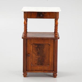 An early 20th century bedside table.