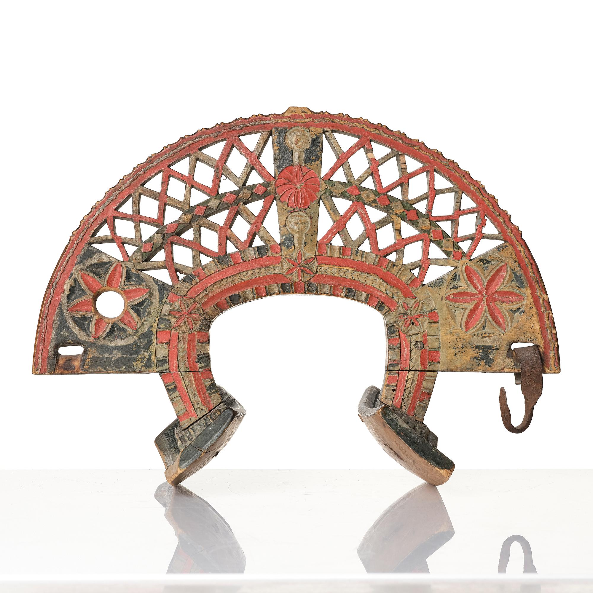 A Swedish folk art carved and polychrome-painted part horse harness, Uppland, dated 1774.