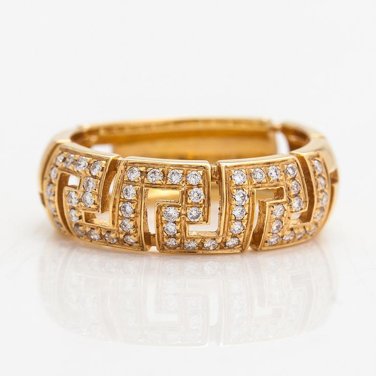 Versace, An 18K gold ring with diamonds ca. 0.12 ct in total. Marked Versace.