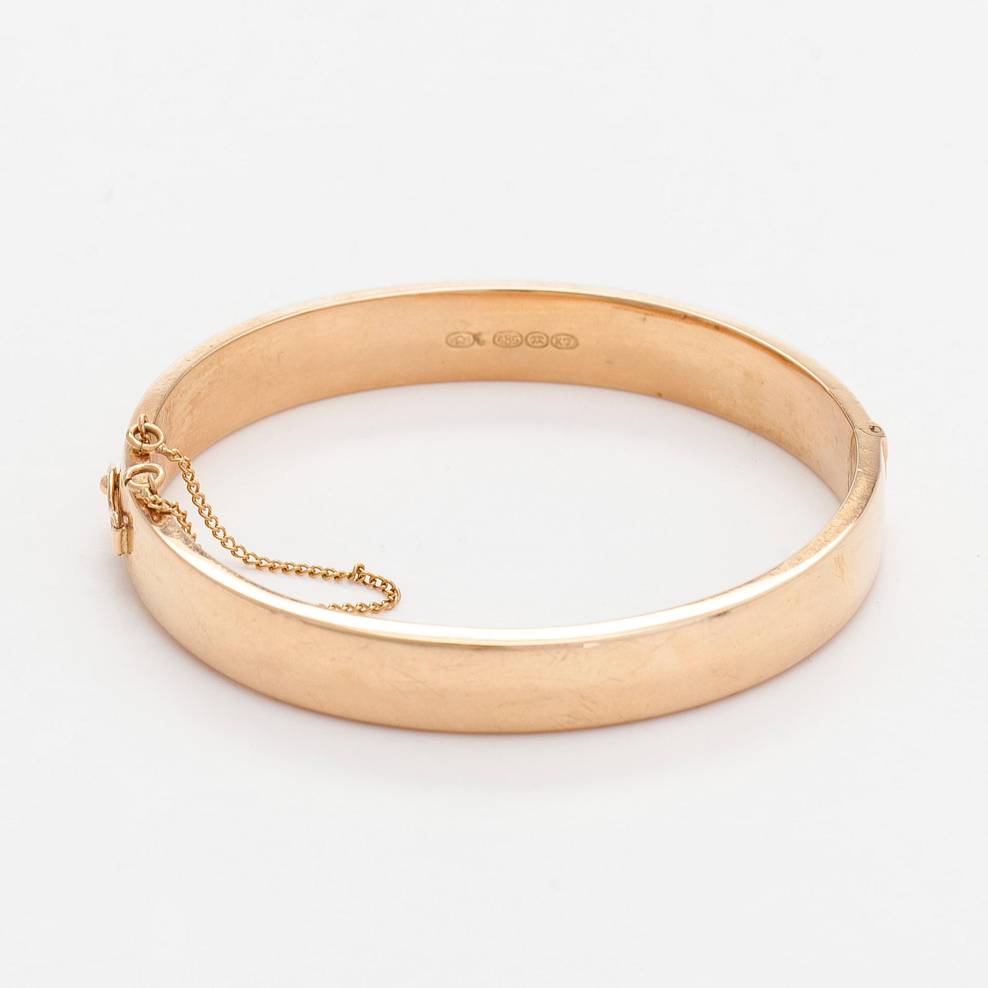 A 14K gold bracelet.