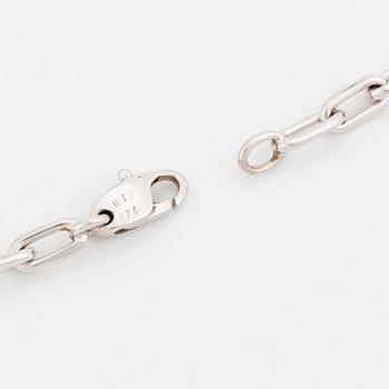 An 18K gold and white gold Cartier necklace with a charm.