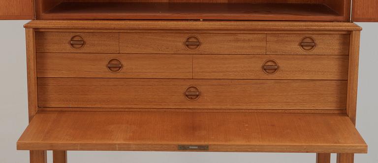 A Carl Malmsten mahogany cabinet with inlays of different types of wood, signed and dated 1958.