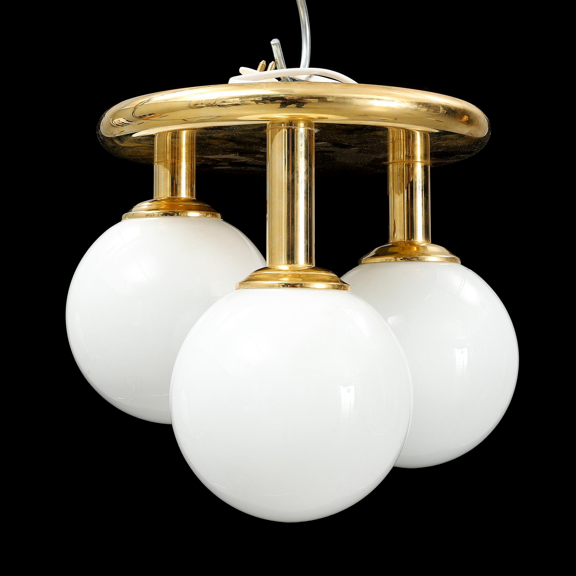 A contemporary brass and glass ceiling light.
