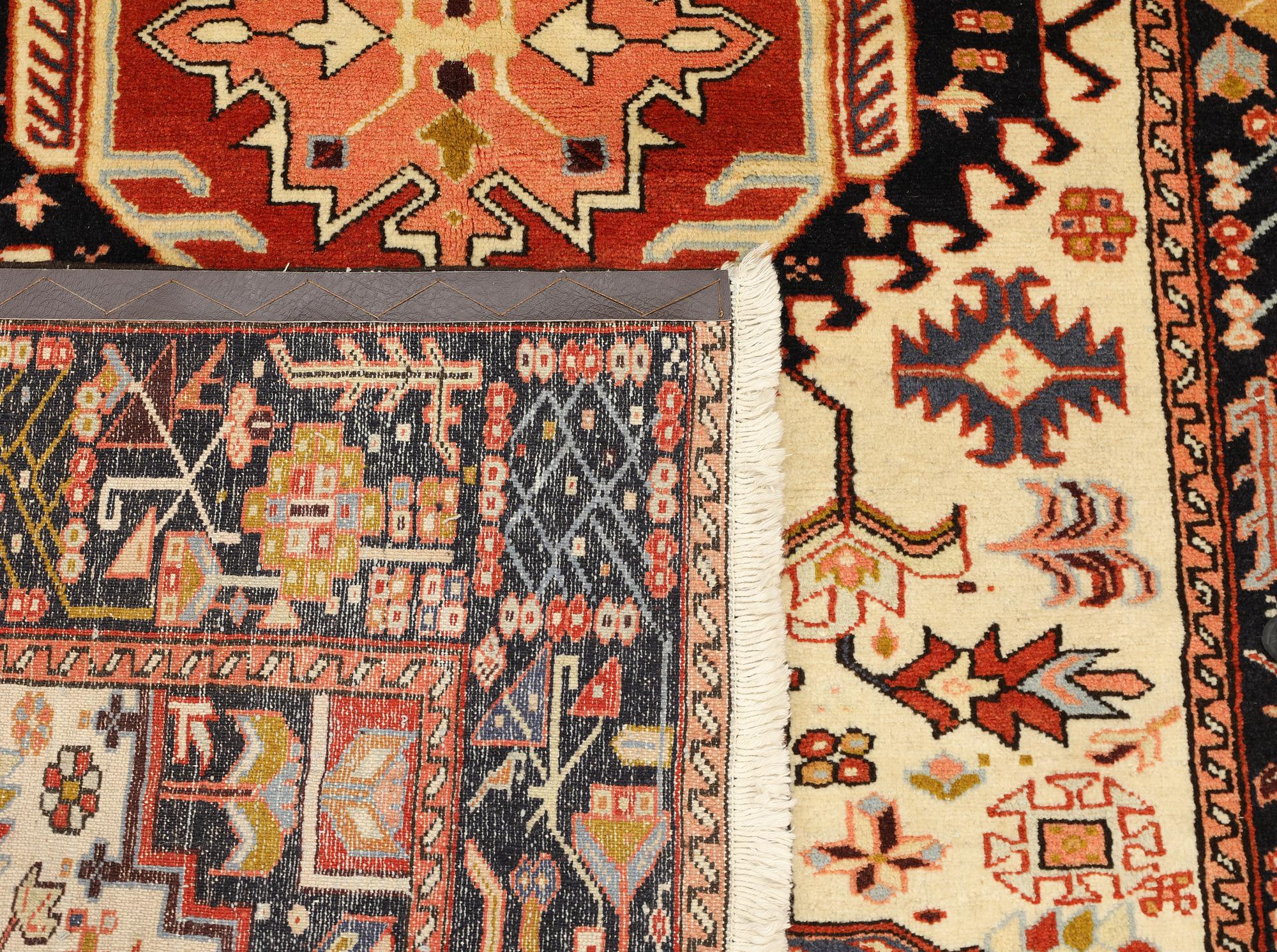 A Heris carpet, approx. 211 x 140 cm.