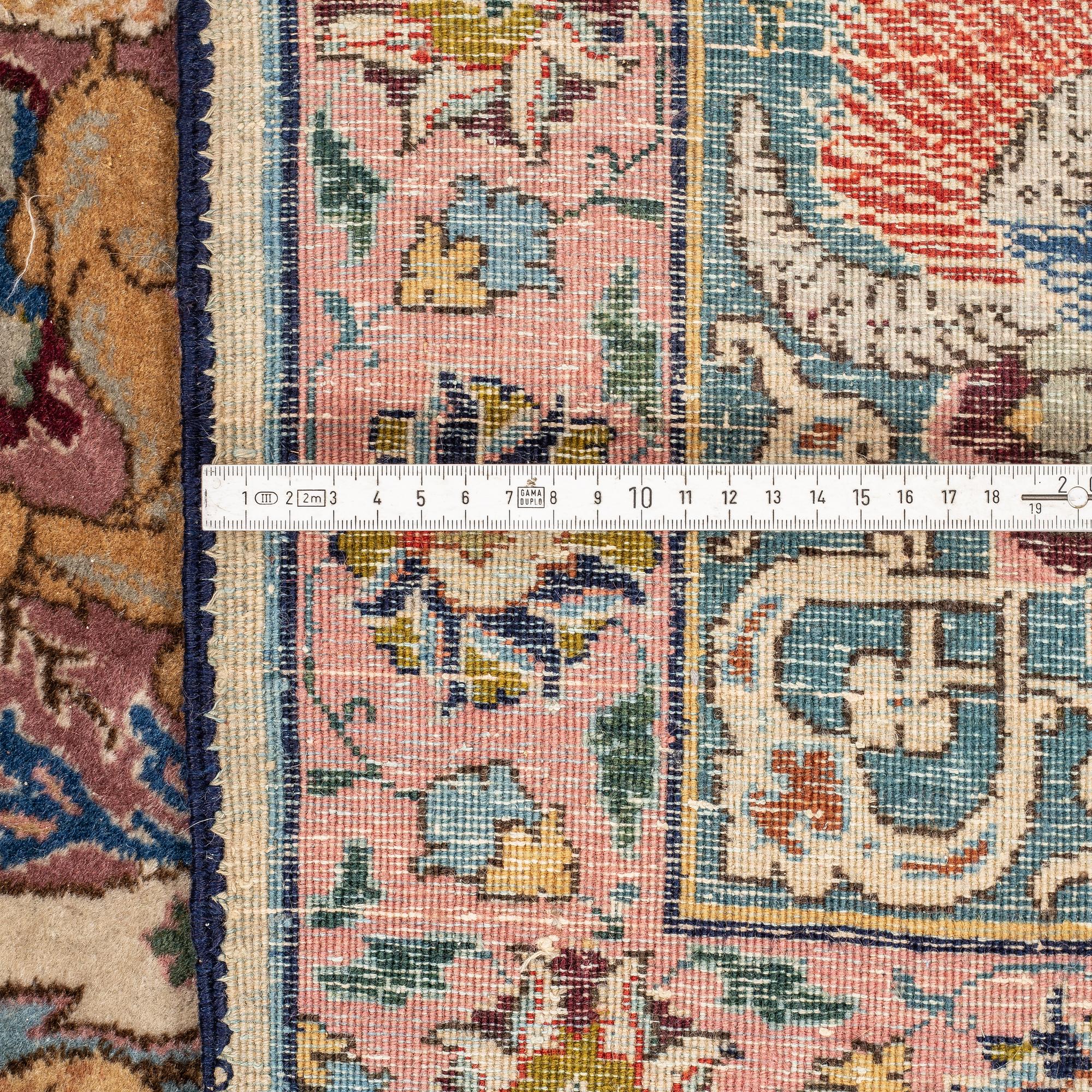 A carpet, a semi-antique Tabriz figural, ca 354,5-362 x 250,5-258 cm.