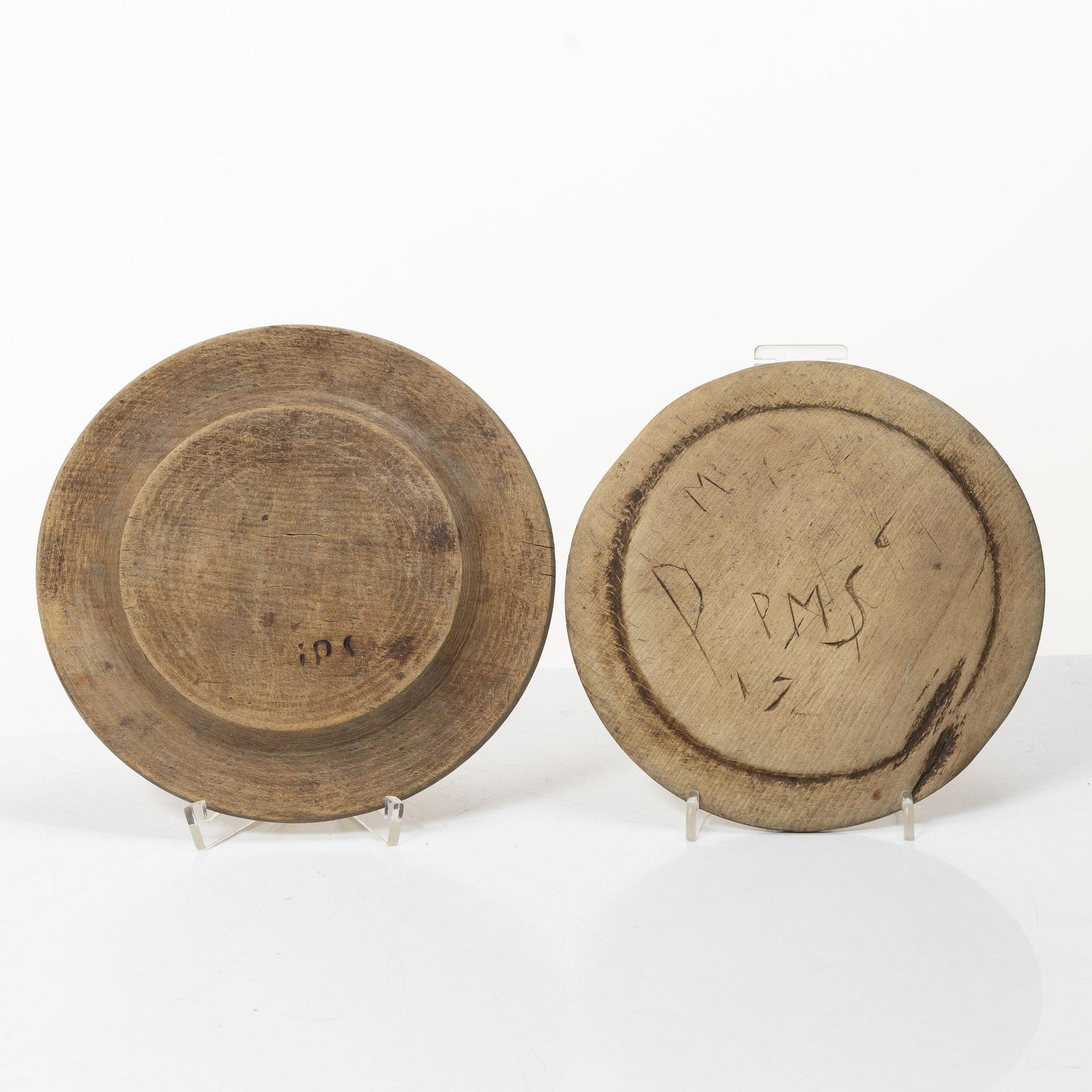 Twelve wooden plates, 19th Century.