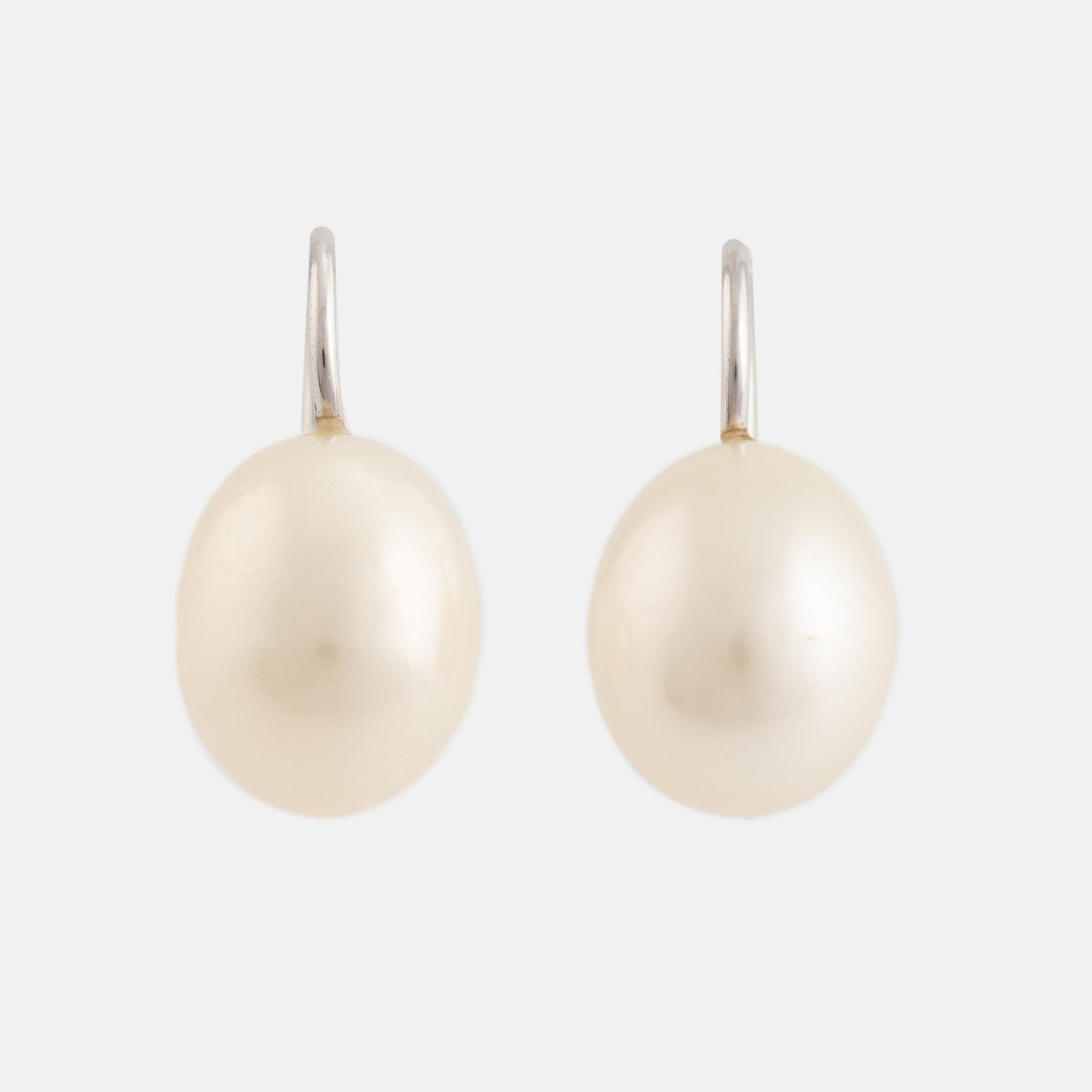 A pair of white gold earrings with cultured pearls.