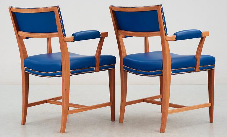 A pair of Josef Frank mahogany and blue leather armchairs, Svenskt Tenn, model 695.