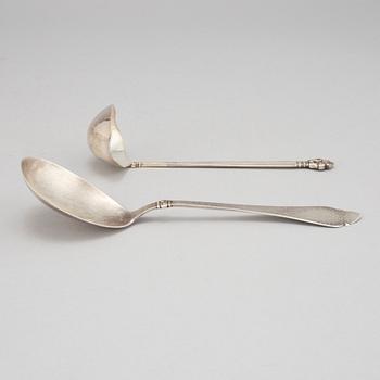 Johan Rohde, an 'Acorn' sterling sauce ladle, Georg Jensen post 1945 + a Danish silver serving spoon, Copenhagen 1931.