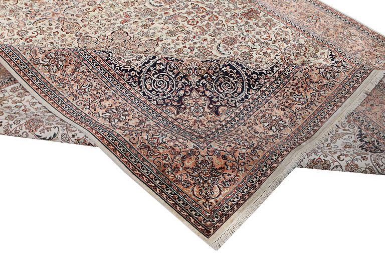 A carpet, silk Kashmir, ca. 358 x 252 cm.