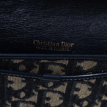 Christian Dior, a clutch and a scarf.
