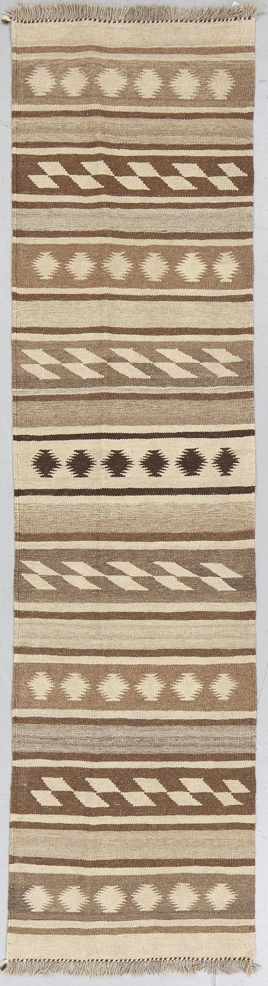 A runner, kilim, ca 240 x 62 cm.