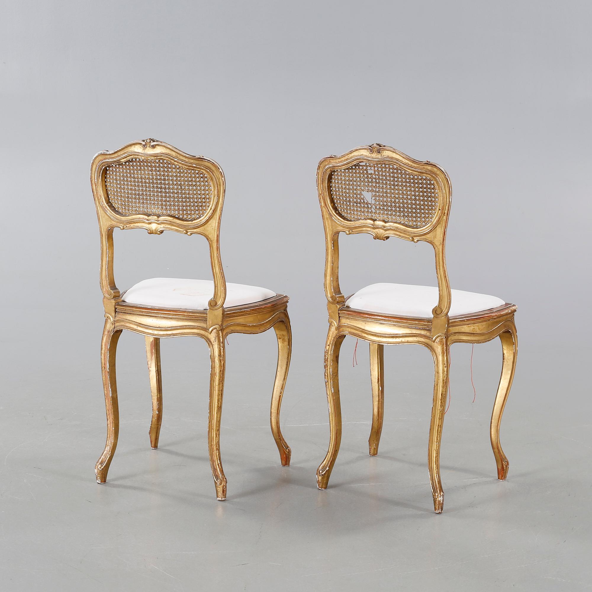 A pair of chairs from the first half of the 20th century.