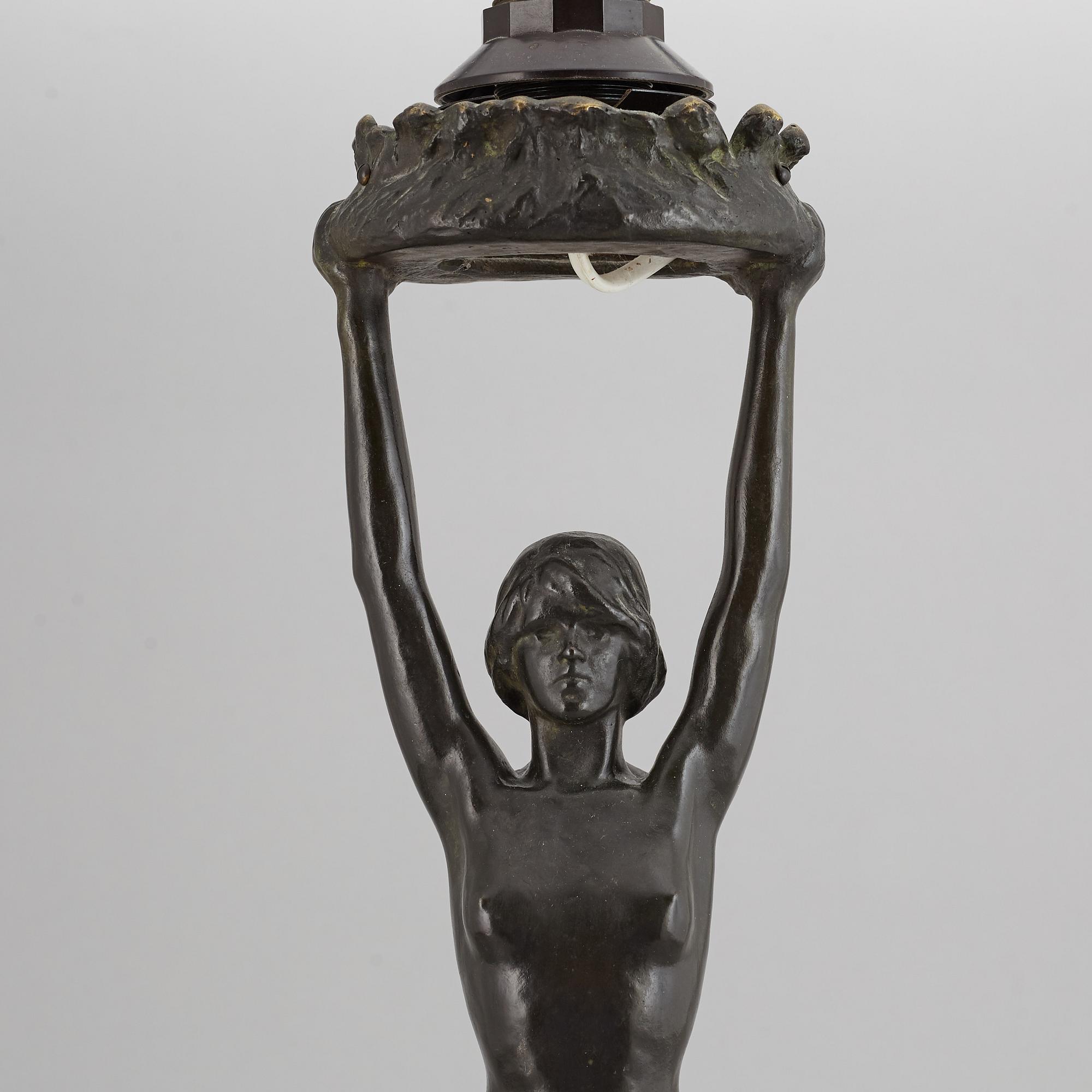 GERDA SPRINCHORN, an Art Nouveau green patinated bronze lamp "The Sun", Herman Bergman, Stockholm, early 20th century.