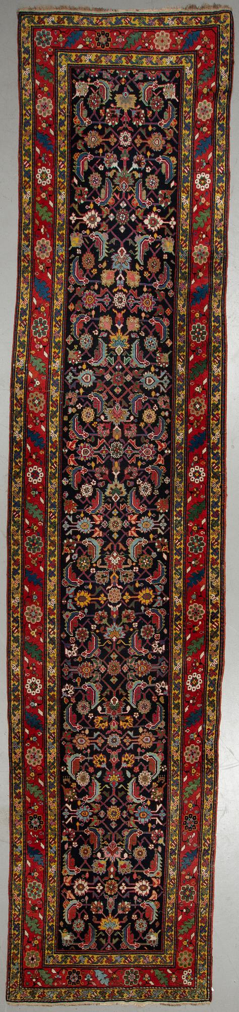 A RUNNER, semi-antique Karabagh, ca 500 x 106 cm.