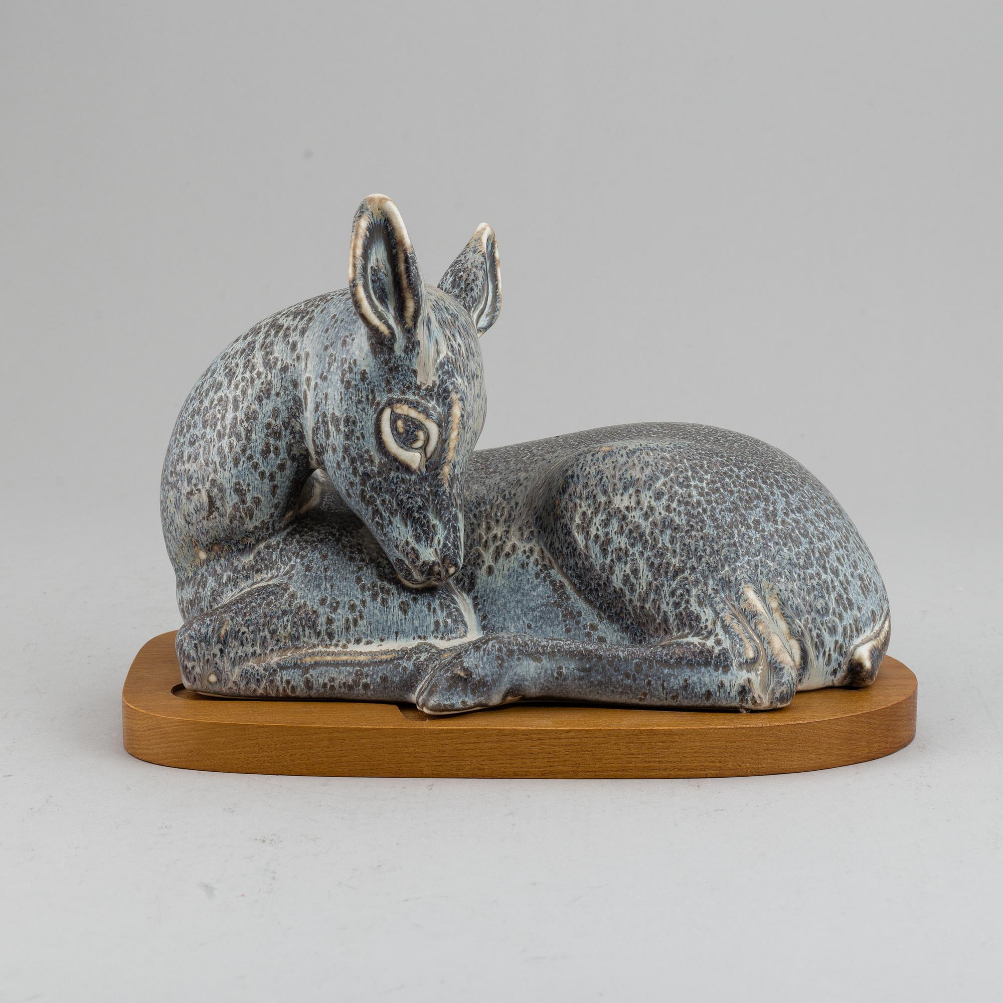GUNNAR NYLUND, a unique stoneware sculpture of a reclining deer, Rörstrand, Sweden mid 20th Century.