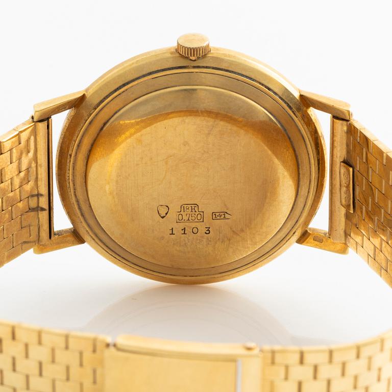 Deco, 18k wristwatch with bracelet in 18K gold, 34 mm.