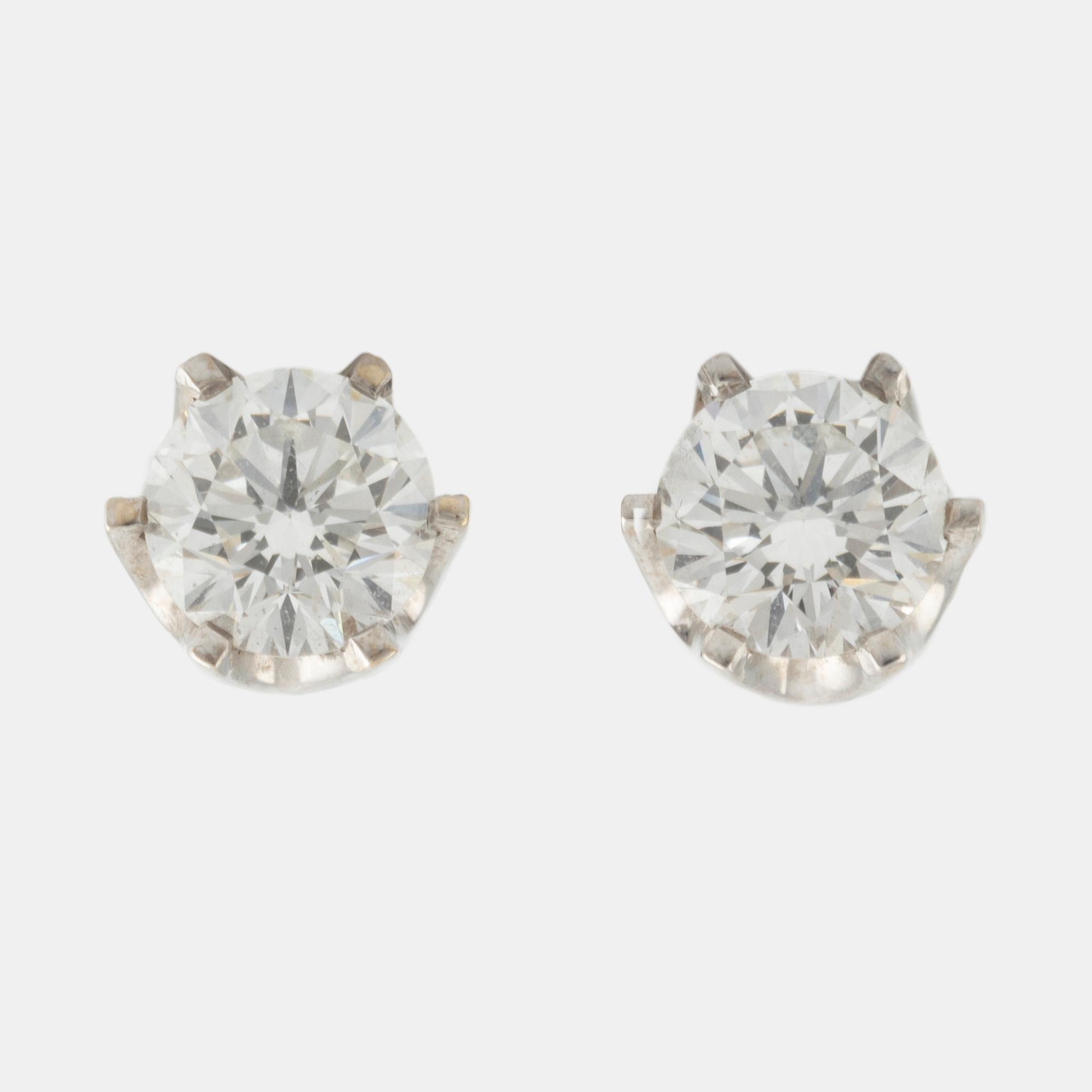 Brilliant cut diamond stud earrings.